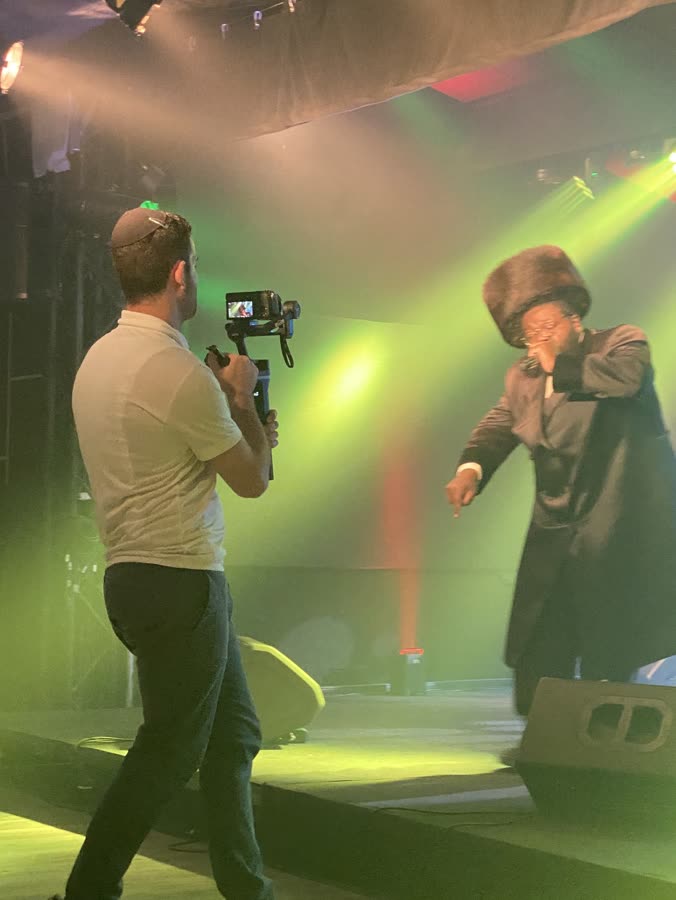 Filming a singer on stage from the floor, camera on a gimbal