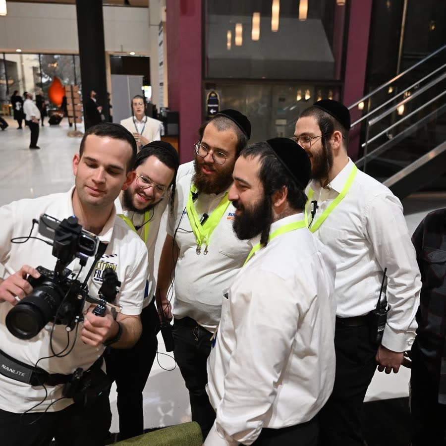 Yaakov showing the event's staff the footage on the back of the camera
